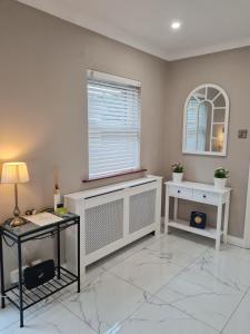 a living room with a window and a marble floor at Brielle House in Mountmellick