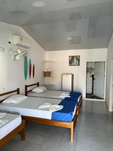 Voodi või voodid majutusasutuse Tintipan Hotel toas