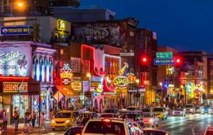 a busy city street at night with cars and traffic lights at Music City Holiday 2 Bedroom 5 Beds POOL Parking in Nashville