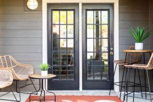 a front door of a house with chairs and tables at Stylish Downtown Nashville 3 Beds, 1 Bedroom with Private Patio, Parking in Nashville