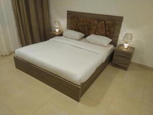 Un ou plusieurs lits dans un hébergement de l'établissement Al RAYAN HOTEL