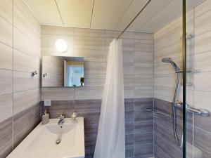 a bathroom with a shower and a sink at Chalet Montriond in Les Crosets