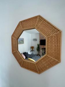 a mirror hanging on a wall in a room at Waterloo Street in King's Lynn