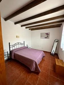 a bedroom with a bed in a room with wooden ceilings at Casa Fagajesto in Las Palmas de Gran Canaria +32 photos