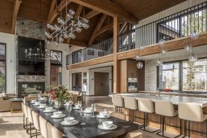 a large dining room with a long table and chairs at Skylark Chalet in Big Sky