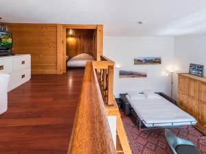 a living room with a bed and a bedroom with a bed sqor at Studio Courchevel 1650, 1 pièce, 5 personnes - FR-1-563-31 in Courchevel