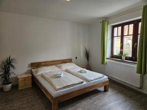Postel nebo postele na pokoji v ubytování Apartmány Karolína - Kašperské Hory