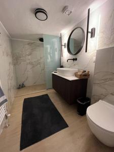 a bathroom with a sink and a toilet and a mirror at K&M 40 Ekklision A’ in Drama