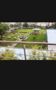 a view of a park from a balcony of a building at HOTEL THE VILLA in Bhopal