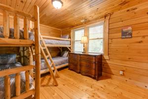 a log cabin bedroom with bunk beds and a desk at Home with Indoor Spa 8 Mi to Smoky Mtn Natl Park! in Waynesville