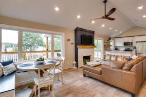 a living room with a couch and a table at Sunrise Beach Home on the Lake of the Ozarks! in Sunrise Beach