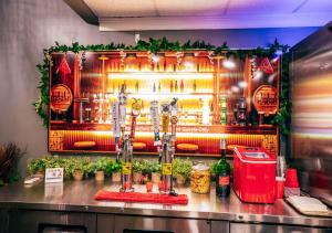 a bar with a display of bottles of alcohol at Lx Hotel, Manchester, Tennessee in Manchester