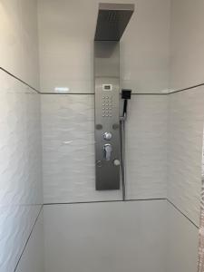 a bathroom with a phone in the corner of a room at Chambre privée-Clim-TV-Confort-Breakfast inclus in Nevers +34 photos