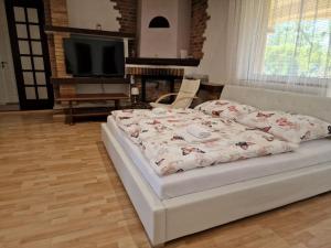 Posteľ alebo postele v izbe v ubytovaní Penzion Lea