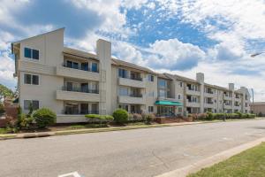an apartment building on the side of a street at Fiddler on the Reef at Playa Rana in Virginia Beach