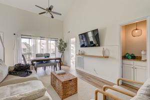 a living room with a couch and a table at 5 mins to beach w/ Pool & Views in Myrtle Beach