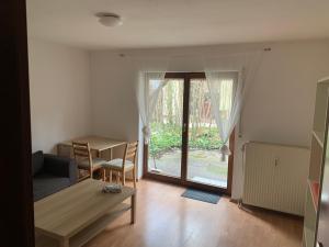 a living room with a couch and a table at Studio Heidelberg in Heidelberg