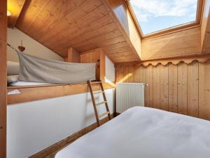 Łóżko lub łóżka w pokoju w obiekcie Duplex Moderne à Méribel : Ski aux Pieds, Piscine et Spa Inclus - FR-1-566-55
