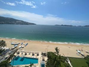 an aerial view of a beach and the ocean at CAMELIA Y MAGNOLIA ACAPULCO in Acapulco