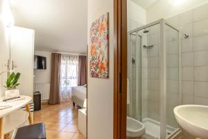 a bathroom with a shower and a sink at Plaza Rooms Ciampino in Ciampino +37 photos
