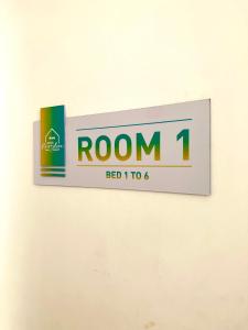 a sign for room on a wall at Miami House in Miami