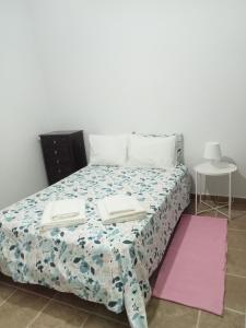 Кровать или кровати в номере Quarto duplo