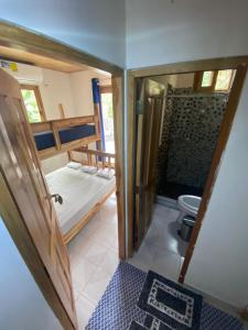 a small bathroom with a toilet and a shower at Casa de la playa in Santa Catalina