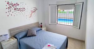 Postel nebo postele na pokoji v ubytování CASA SOLEADA Piscina CLIMATIZADA y PRIVADA + 32 fotografií