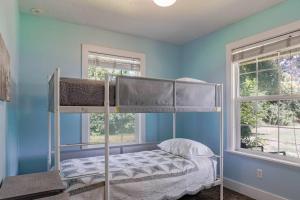 a bedroom with two bunk beds in a blue wall at Roller Mills Retreat - 16+ in Lehi