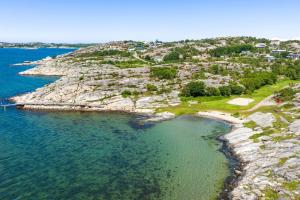 an aerial view of a rocky island in the water at By The Bay room in a shared villa in Gothenburg