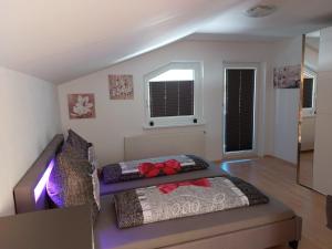 a bedroom with two beds in a room at Lieblingsplatzl in Neustift im Stubaital