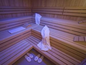 a sauna with slippers on the floor of it at Gasthof Pitztaler Hof in Wenns