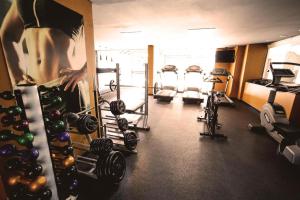 a gym with several treadmills and cardio machines at Kubitschek Plaza Hotel - flat particular in Brasília