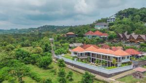 an aerial view of a house with at Alam Sweet Ulu-Modern "Balinese Style Villa" 3 Large Comfy Beds 2 private Bedrooms, Panoramic Ocean Views Pool in Uluwatu