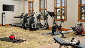 a fitness room with treadmills and exercise bikes at Exquisite Upscale Oasis · Ski Resort in Breckenridge