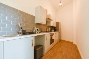 a kitchen with a sink and a counter top at Suite in the heart of Great Harwood in Great Harwood