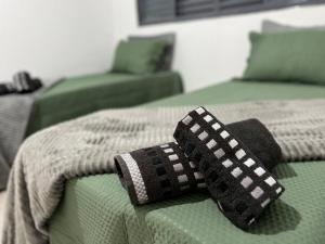 Postel nebo postele na pokoji v ubytování Acolhedora casa de 03 quartos