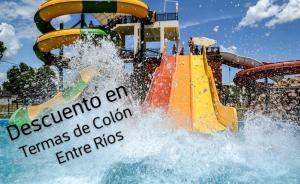 a water slide at a water park with people on it at Vergniaud 70 in Colón