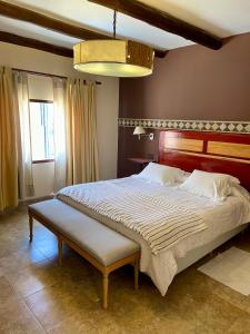 A bed or beds in a room at Refugio del Sol Hosteria