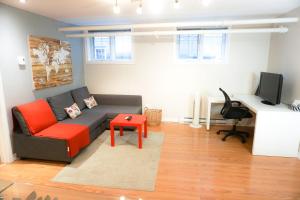 a living room with a couch and a table at Free Parking - Great 1BR near Henri Bourassa Metro in Montreal