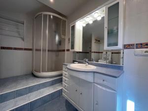 a bathroom with a sink and a shower at Appartement Saint-Jean-de-Luz, 3 pièces, 4 personnes - FR-1-239-936 in Saint-Jean-de-Luz