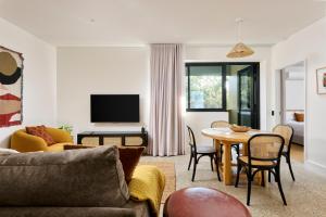 a living room with a couch and a table at Southcamp in Dunsborough
