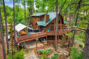 an overhead view of a house in the woods at Furnished Deck and Forest Views Pine Retreat! in Pine