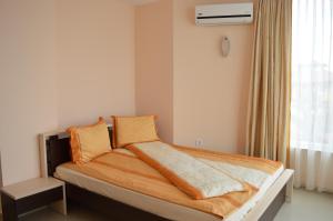 Postel nebo postele na pokoji v ubytování Zafo Hotel