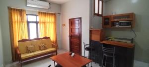 a living room with a couch and a table at Mini Departamento Iquitos 1245-01 in Iquitos