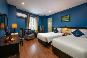 Ένα ή περισσότερα κρεβάτια σε δωμάτιο στο Hanoi 20 Hotel & Apartment