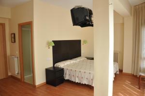 Postel nebo postele na pokoji v ubytování Hostal Ruiz