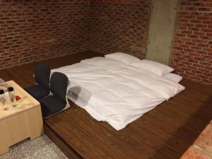 Postel nebo postele na pokoji v ubytování 森活藝術文旅 + 9 fotografií