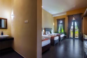 Postel nebo postele na pokoji v ubytování Paddyway Resort + 37 fotografií