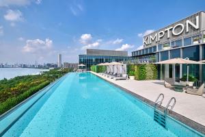 a swimming pool on the roof of a hotel at Kimpton Qiantan Shanghai, an IHG Hotel in Shanghai